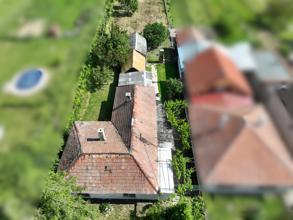 Na PREDAJ veľkorysý pozemok so starším domom v obci Dolné Orešany